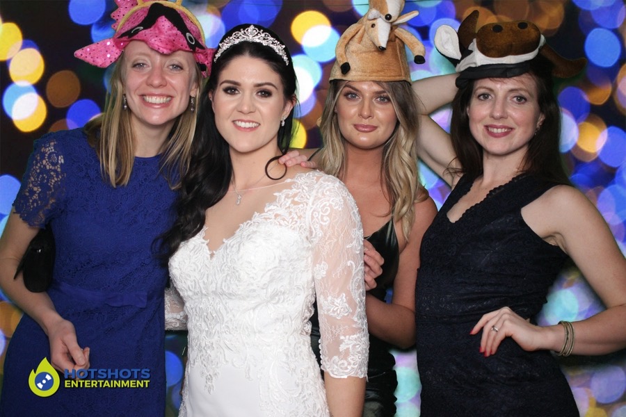 Wedding guests having a great time in the photo booth hire