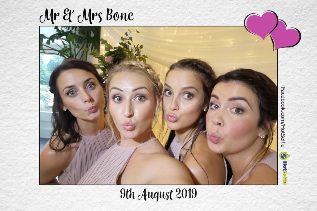 Bridesmaids having a selfie, looking good at Homewood park for a wedding.